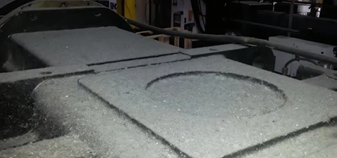 Industrial surface covered in heavy dust and debris, shown before cleaning services.