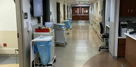 Healthcare facility painting—freshly painted interior hallway of a hotel with clean polished floors.